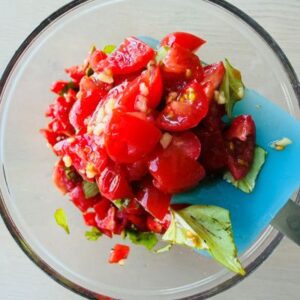 Add Diced Tomatoes and Basil Ribbons to Whisked Olive Oil, Garlic, & Balsamic Vinegar