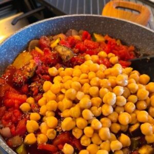 Add Tomatoes, Spices, Red Wine, & Chickpeas