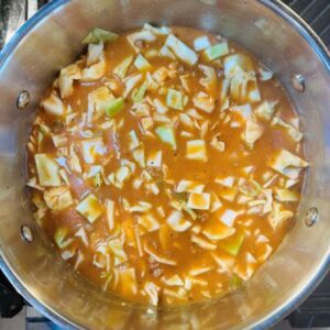 Add Vegan Tomato Soup, Vegetable Broth, Spices, & Cabbage, and Simmer for 20-25 Minutes