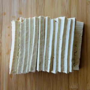 Blot Extra-Firm Tofu Dry and Slice Into Quarter-Inch Thick Slabs