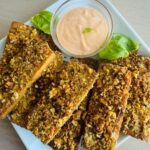 Crispy Baked Tofu on a Plate with a Sriracha Dipping Sauce