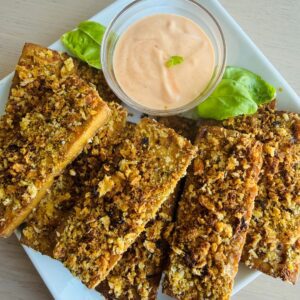 Crispy Baked Tofu on a Plate with a Sriracha Dipping Sauce