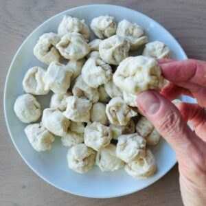 Gently Pull Off Pieces of Dough and Very Lightly Form Into A Rough Ball