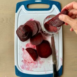 Peel and Slice Beets, Pack into Jars, and Cover with Brine