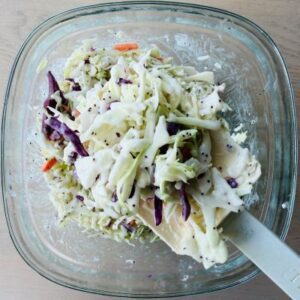Prepare 2 Ingredient Coleslaw with a Package of Coleslaw Shreds and Brianna's Poppyseed Dressing