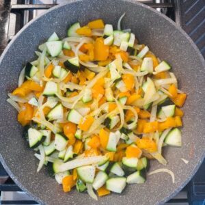 Sauté Diced Onions, Bell Pepper, Mushrooms, and Zucchini