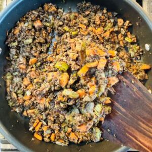 Sauté Meaty Mushroom Filling with Onions, Celery, Carrots, Mushrooms, and Spices