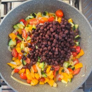 Stir in Tomatoes and Black Beans to Heat Through