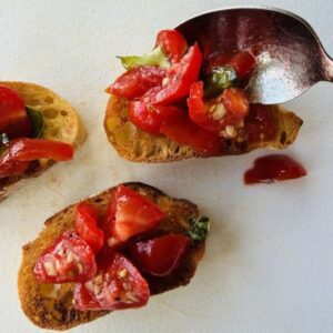 Top Each Baguette Slice with a Generous Spoonful of the Bruschetta Mixture